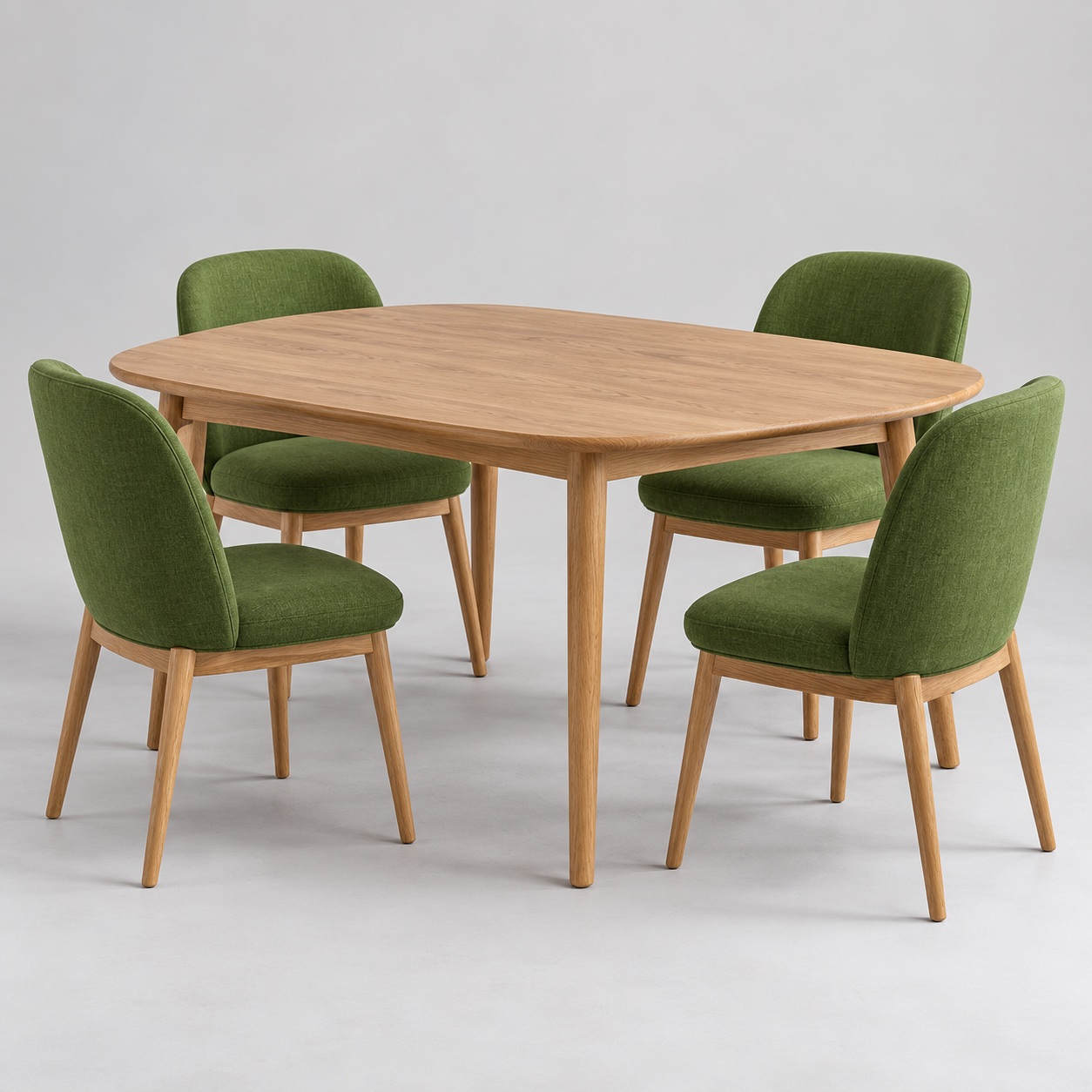 An oak dining table with four green upholstered chairs