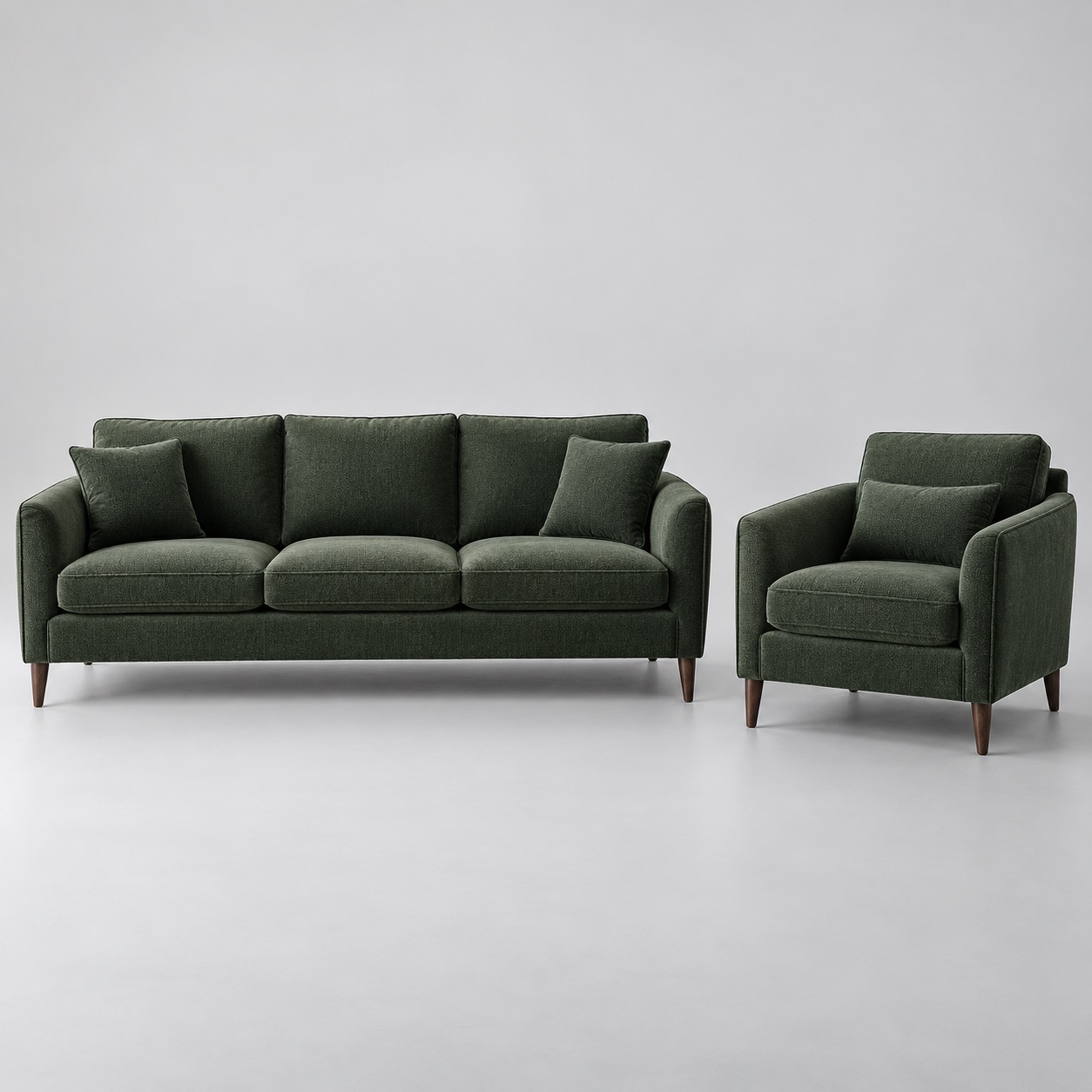 A charcoal-green three-seat sofa and matching armchair